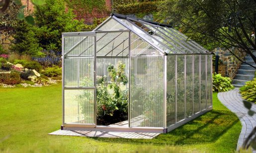 A Greenfingers greenhouse filled with lush plants.